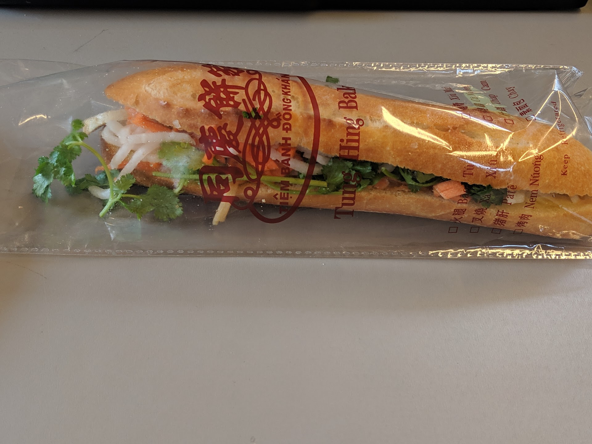 Wrapped branded banh mi on counter