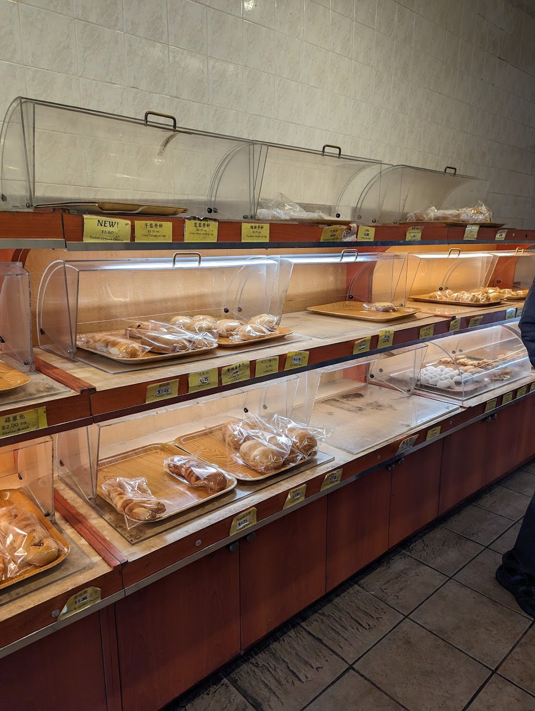 Variety of wrapped pastries and baked goods with price tags